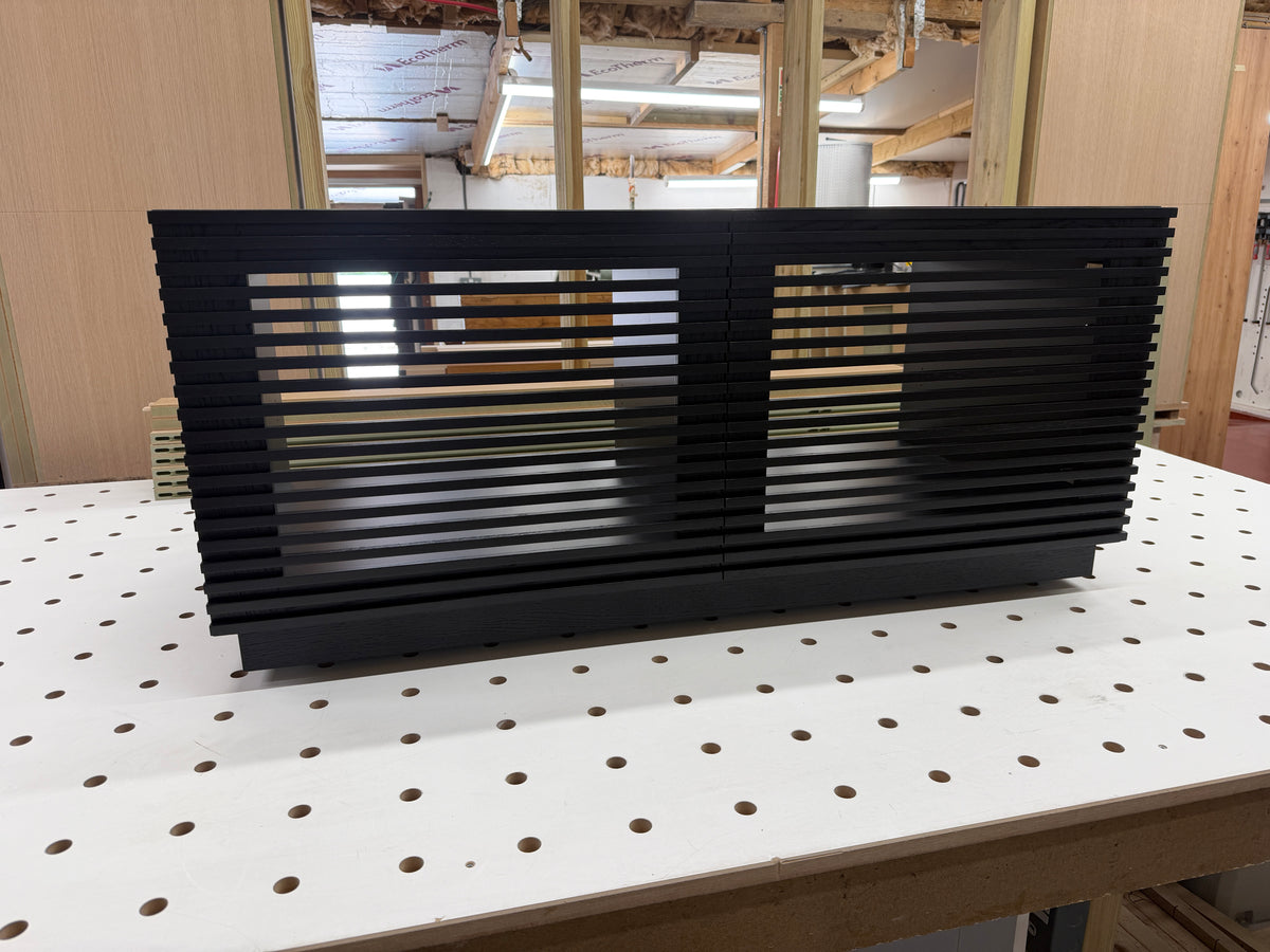 black wooden cabinet for bespoke media wall set ups. custom build furniture for recording studio 