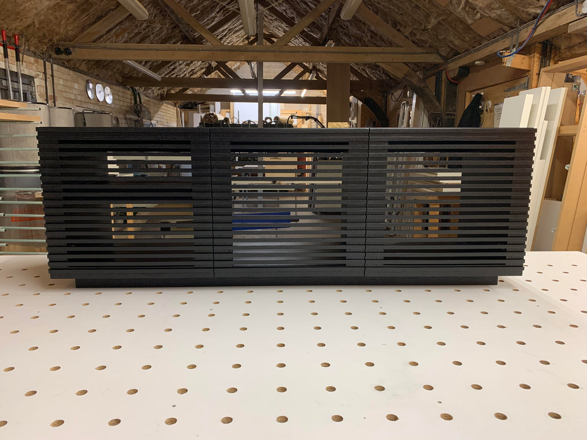 Linear Trio Large AV Cabinet in black wood finish, with three compartments and an open-back design